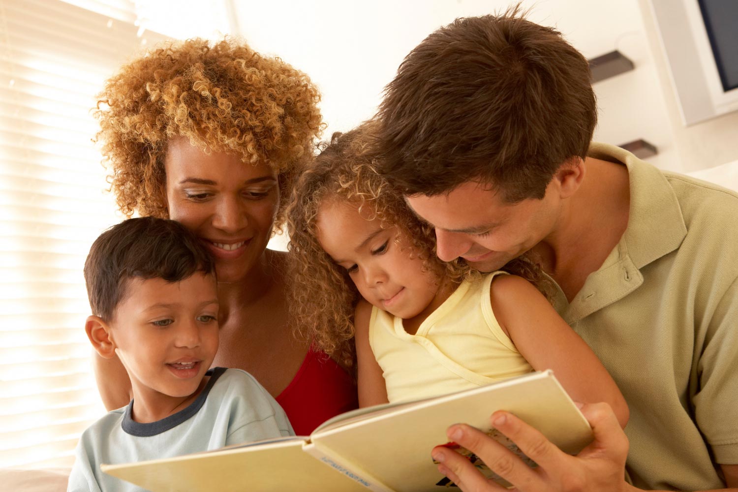 A mom and dad spend time together with their kids.