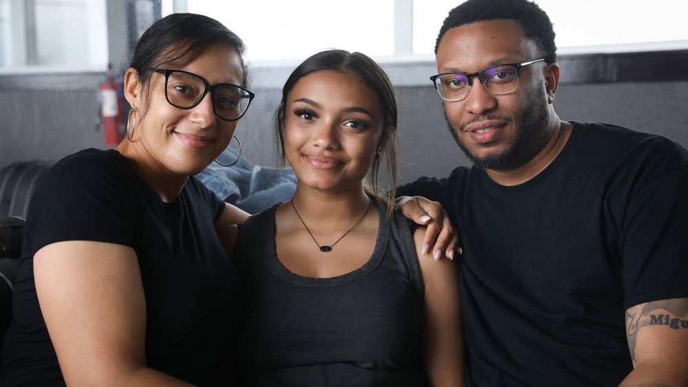 Mom and dad supporting teenage daughter