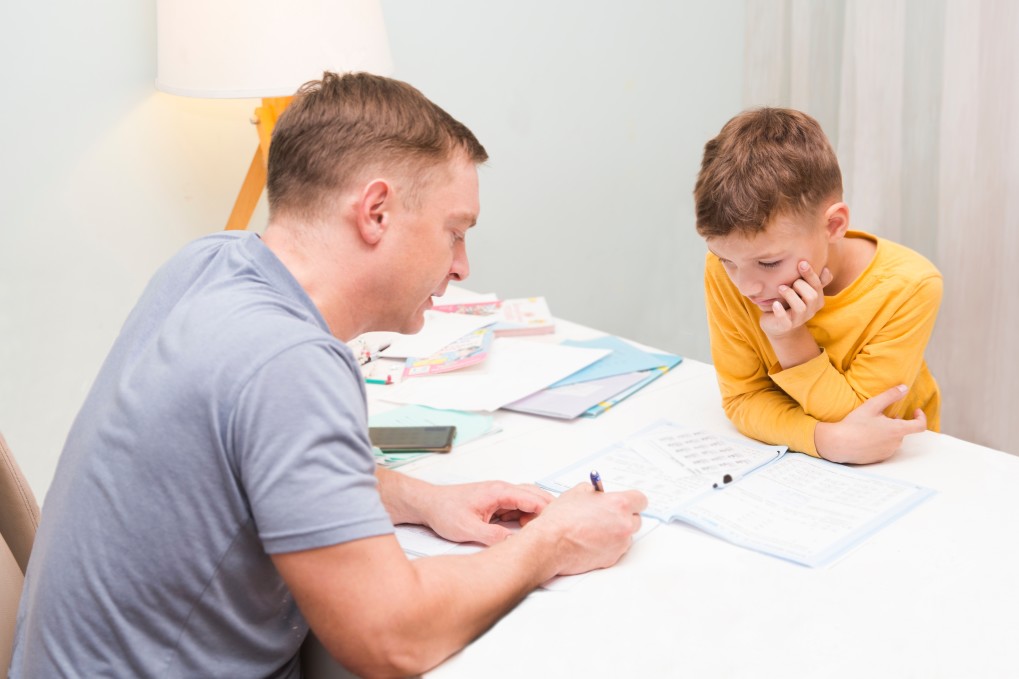 dad helping son with homework