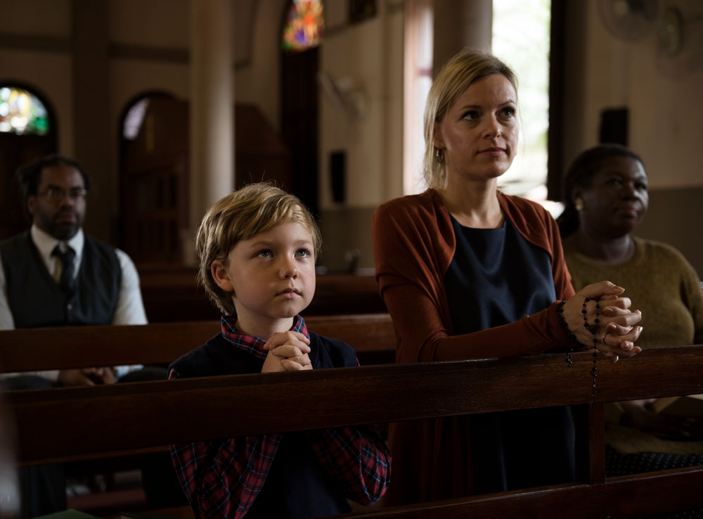 mother and son in church
