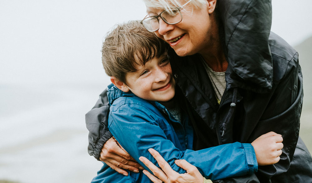 Child hugging grandmother