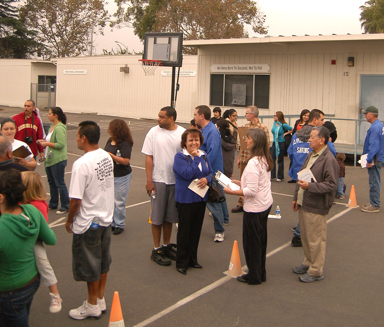 Group gathers at school playground.