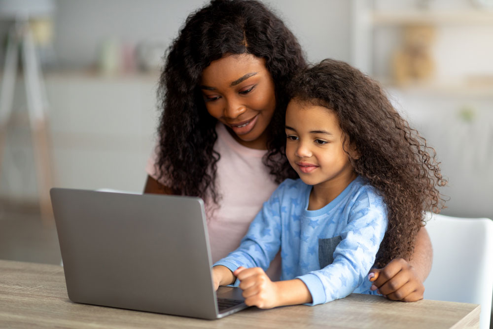 Mom helping child with homework